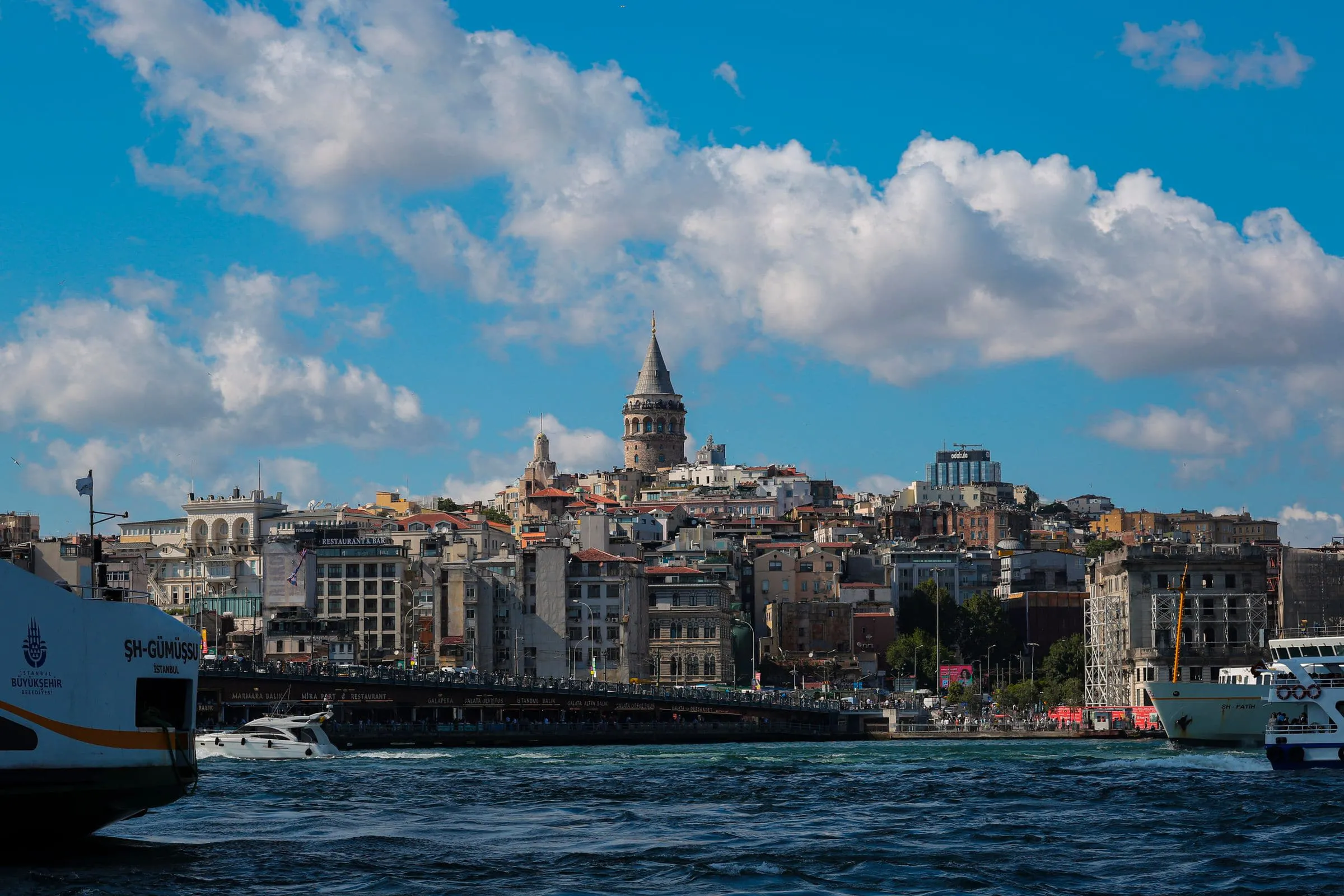 Ferries crossing the water below the Galata tower in Istanbul